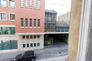 a black car parked in front of a building at Budapest Pest-port apartment 4 rooms for 16 person in Budapest +22 photos