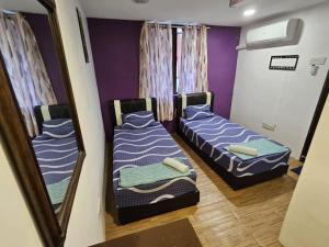 Postel nebo postele na pokoji v ubytování HOTEL Rampai Rooms