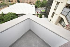 a view from the balcony of a building with white walls at Aygestan plaza apartment 5 in Yerevan