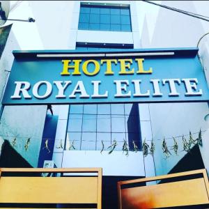 a hotel royale sign on the side of a building at Hotel Royal Elite in Rajkot