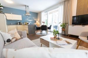 TV a/nebo společenská místnost v ubytování Residenz - Nebelgruß - Seeterrasse - Sauna - Parkplatz