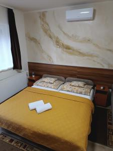 Postel nebo postele na pokoji v ubytování Boglárka Vendégház
