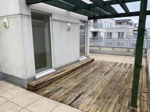 a balcony of a building with a wooden floor at Leicester Contractor Home - Syster Properties - Spacious Rooms in Leicester