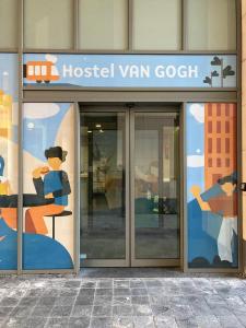 a hospital van gogh sign on the side of a building at Hostel Van Gogh in Brussels