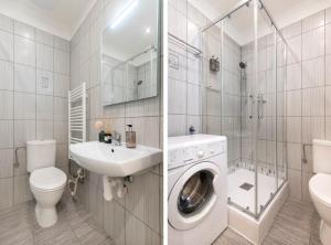 プラハにあるPrague Serenity Suites and Apartmentsのバスルーム(洗濯機、トイレ、シンク付)
