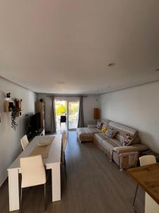 a living room with a couch and a table at Residence Balcòn del Atlàntico Costa Adeje in Adeje