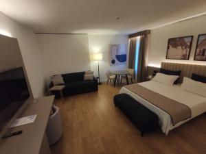 Postel nebo postele na pokoji v ubytování Vittoria Parc Hotel
