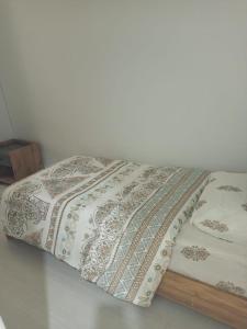 a bed with a pillow on top of it at APARTİST in Istanbul