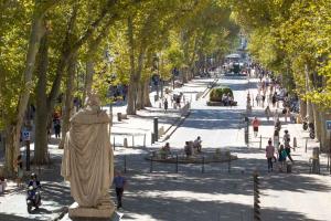 a statue of a woman in a park with trees at Terrasse & Spa dans Aix Hypercentre in Aix-en-Provence +3 photos