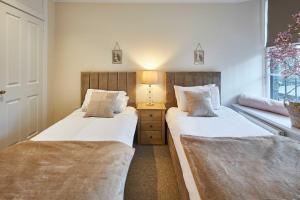Voodi või voodid majutusasutuse Host & Stay - Hide Hill Apartments toas
