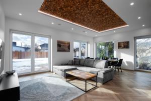 a living room with a couch and a table at Posti villa in Pärnu