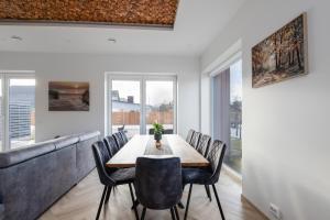 a dining room with a table and chairs at Posti villa in Pärnu