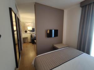 Postel nebo postele na pokoji v ubytování Vittoria Parc Hotel