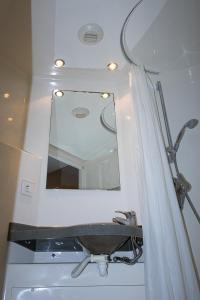 a bathroom with a sink and a mirror at Youth Hostel van Gogh in Brussels +28 photos