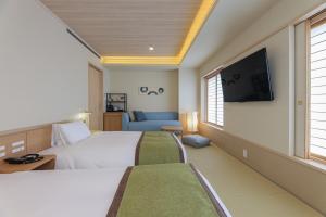 Postel nebo postele na pokoji v ubytování Bayside Hotel Azur Takeshiba
