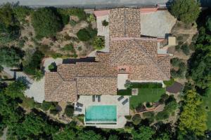 an aerial view of a house with a pool at BELLE VUE Villa climatisée pour 8 personnes avec piscine chauffée et vue mer panoramique à La Londe-les-Maures in La Londe-les-Maures +21 photos