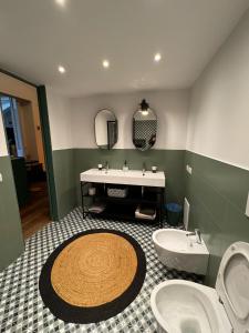 a bathroom with a sink and a toilet at southsidehouse in Naples