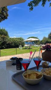 a table with a tray of food and drinks on it at FONDAZIONE VILLA POINT ONLUS in San Felice Circeo