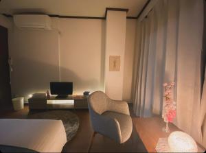 A television and/or entertainment centre at THE MOON Atami