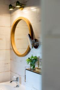 a bathroom with a sink and a mirror on the wall at Statek Poštolka in Svitavy