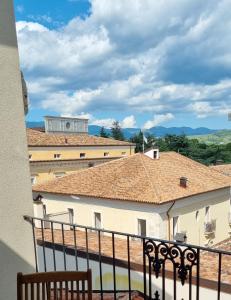a view of a building from a balcony at Antica Dimora San Crisante - centro storico in LʼAquila
