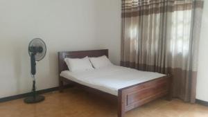 Ένα ή περισσότερα κρεβάτια σε δωμάτιο στο Pirivena Guarden Unit