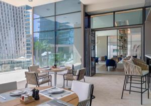 a dining room with a view of a building at Jumeirah Marina Gate Residences in Dubai