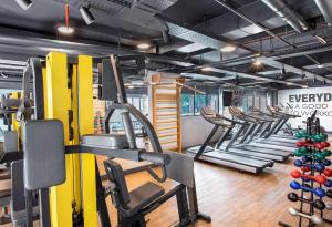 a gym with rows of treadmills and machines at Hotel Av Ibirapuera 2534 Moema São Paulo 3 in São Paulo
