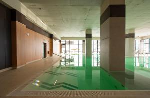 a hallway with a pool of water in a building at Apartmány Planina Predná Hora in Predná Hora