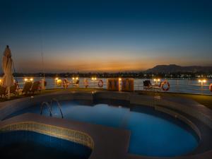 a swimming pool on the deck of a cruise ship at night at Steigenberger Regency Nile Cruise - Every Saturday from Luxor for 07 & 04 Nights - Every Wednesday From Aswan for 03 Nights in Luxor