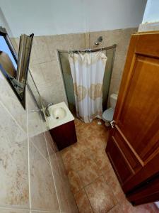 a bathroom with a shower and a toilet at Kati's Room in Eilat