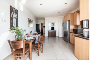a kitchen and dining room with a table and chairs at Aegean Moments in Glinado Naxos +82 photos