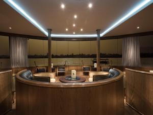 a large room with a round table and chairs at Steigenberger Regency Nile Cruise - Every Saturday from Luxor for 07 & 04 Nights - Every Wednesday From Aswan for 03 Nights in Luxor +8 photos