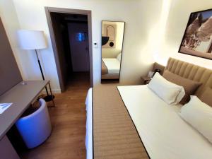 Postel nebo postele na pokoji v ubytování Vittoria Parc Hotel