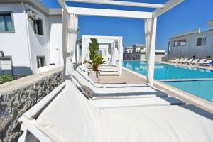 a view of the pool from the balcony of a villa at Skyline Paradise Villas in Kérynia