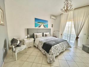 Postel nebo postele na pokoji v ubytování B&B Maison Blanche
