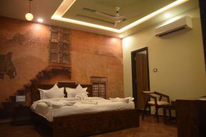 Hotel Pride Of Chittor客房内的一张或多张床位