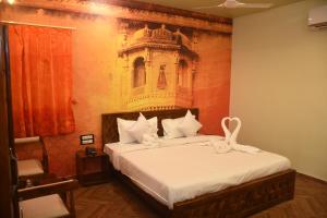 Hotel Pride Of Chittor客房内的一张或多张床位