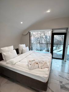 Postel nebo postele na pokoji v ubytování Apple Resort