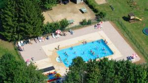 an overhead view of a swimming pool in a park at Glamping Virton in Virton
