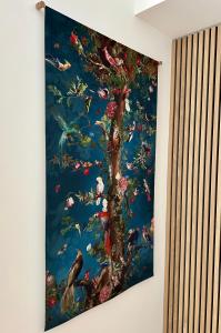 a painting of a tree with fish on a wall at Plaza Tomás in Pamplona