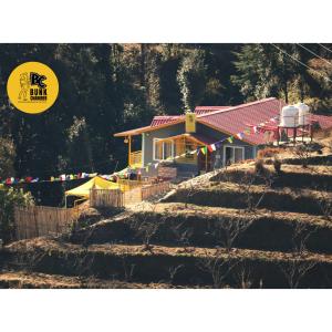 a house on top of a pile of dirt at BUNK CHAMBER in Mukteshwar