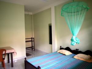 Una cama o camas en una habitación de Amila Guest