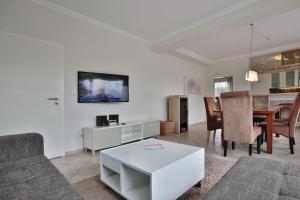 TV a/nebo společenská místnost v ubytování Ferienhaus Kiki Ferienhaus Kiki