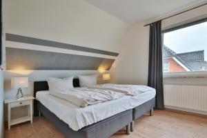 Postel nebo postele na pokoji v ubytování Ferienhaus Kiki Ferienhaus Kiki