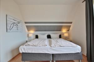 Postel nebo postele na pokoji v ubytování Ferienhaus Kiki Ferienhaus Kiki