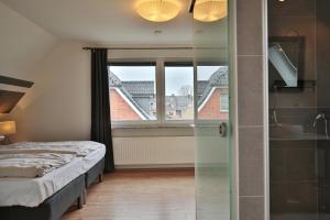 Postel nebo postele na pokoji v ubytování Ferienhaus Kiki Ferienhaus Kiki