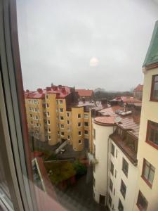 a view from a window of a city with buildings at Modern Apartment In Lovely Part Of The City in Gothenburg