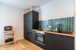 Kuchyňa alebo kuchynka v ubytovaní Charming apartment 2ch 4p parking and balcony