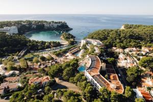 an aerial view of the resort and the ocean at Comitas Floramar in Cala Galdana
